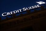 A sign sits illuminated on the roof of the Credit Suisse Group AG headquarters in Zurich, Switzerland, on Monday, May 2, 2016.