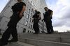Police officers patrol outside the Charite Hospital where Alexei Navalny is being treated, in Berlin, on Aug. 24.