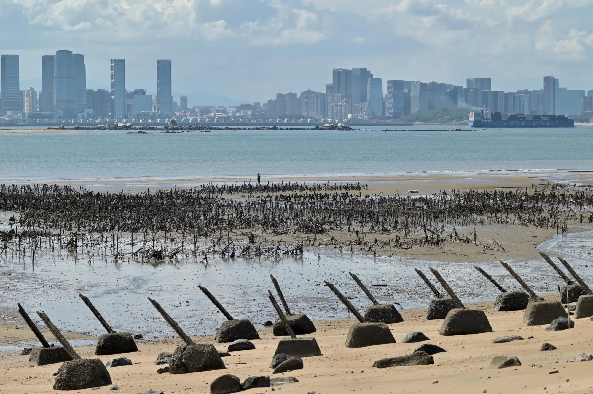 The city of Xiamen on the Chinese mainland is seen past anti-landing spikes placed along the coast of Taiwan’s Kinmen islands.