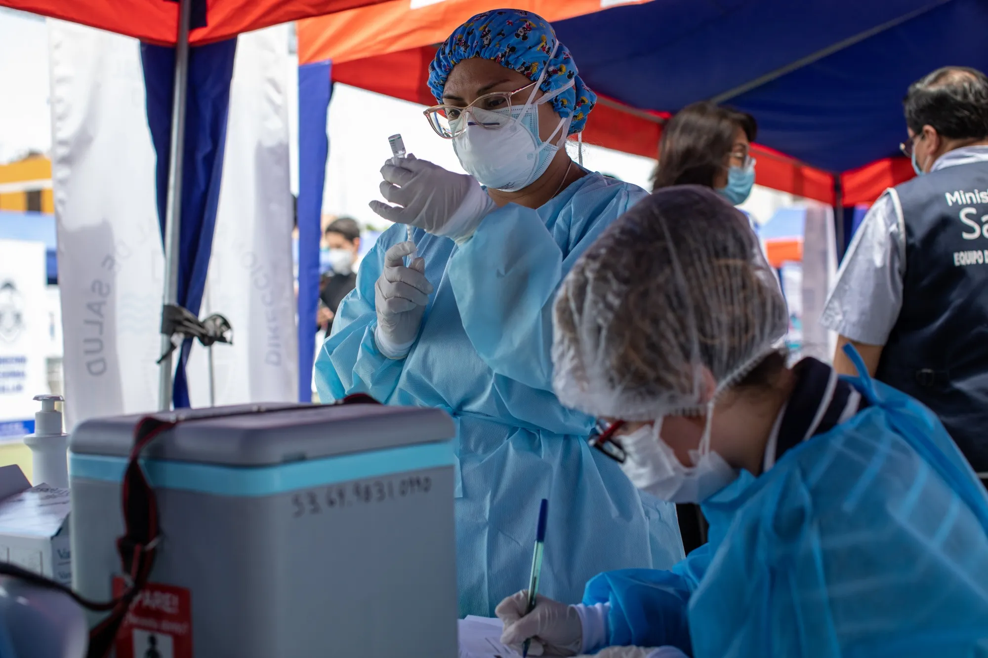 A healthcare worker prepares a dose of the Sinopharm Group Co. Covid-19 vaccine in Lima, Peru, earlier in February.