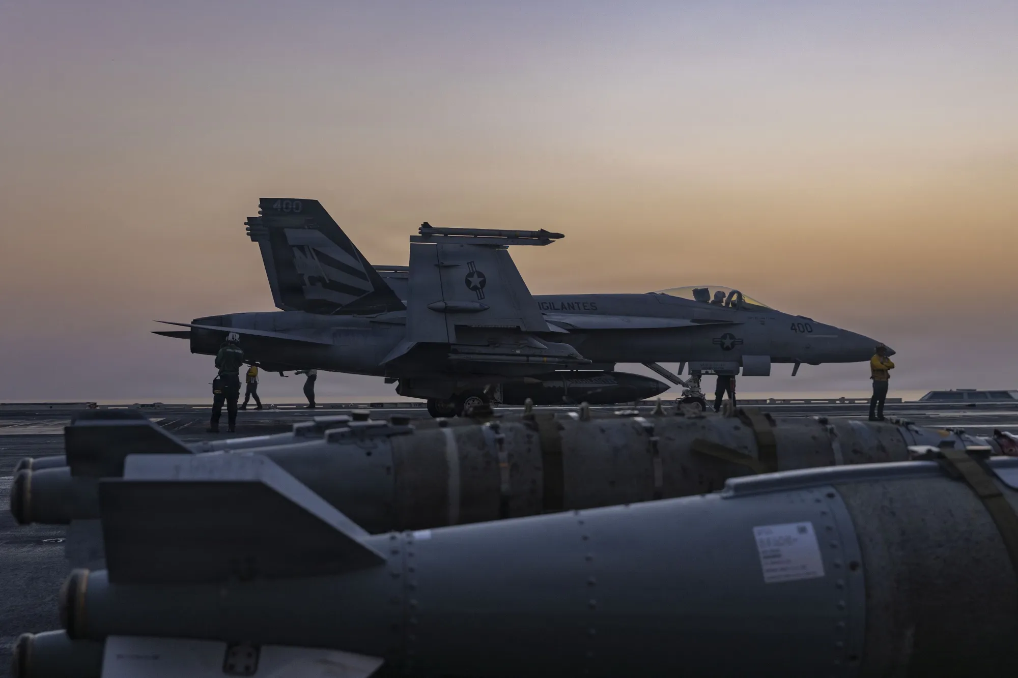 A US F/A-18E Super Hornet prepares to launch from the aircraft carrier USS Abraham Lincoln, one of the ships participating in the air campaign against Iran.