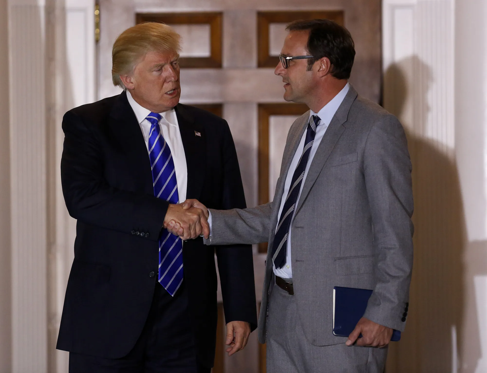Chicago Cubs owner Todd Ricketts, right, leaves the clubhouse of Trump International Golf Club, after meeting with then President-elect Donald Trump in Bedminster Township, New Jersey, on Nov. 19, 2016.
