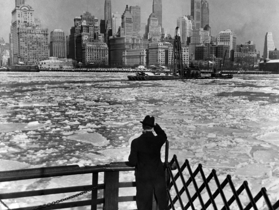 The Hudson river is seen covered with thick ice against a backdrop of Brooklyn skyscrapers in 1936. 
