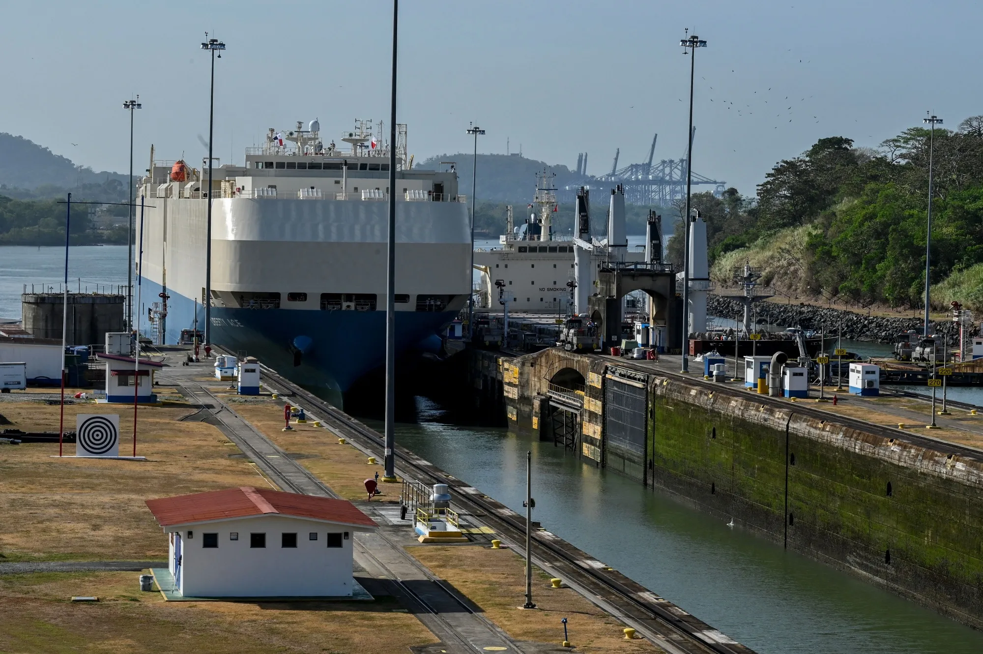 A ship is guided through the Panama Canal's Miraflores locks near Panama City on April 24.
