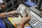 An employee counts Indian rupee banknotes at a Walmart Inc. Best Price Modern Wholesale store in Hyderabad, India.