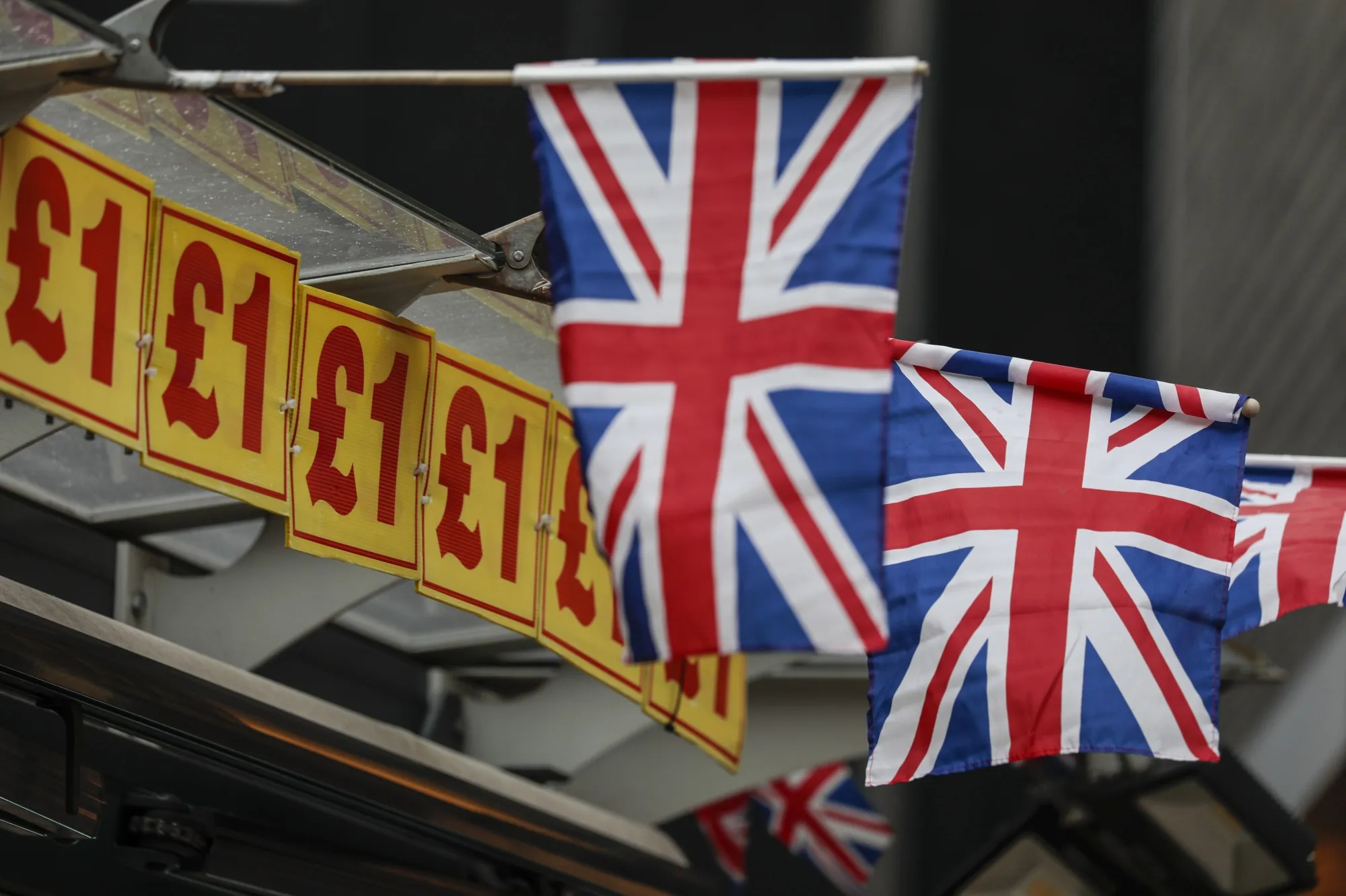 British Union Flags&nbsp;hang from a closed souvenir store in London.