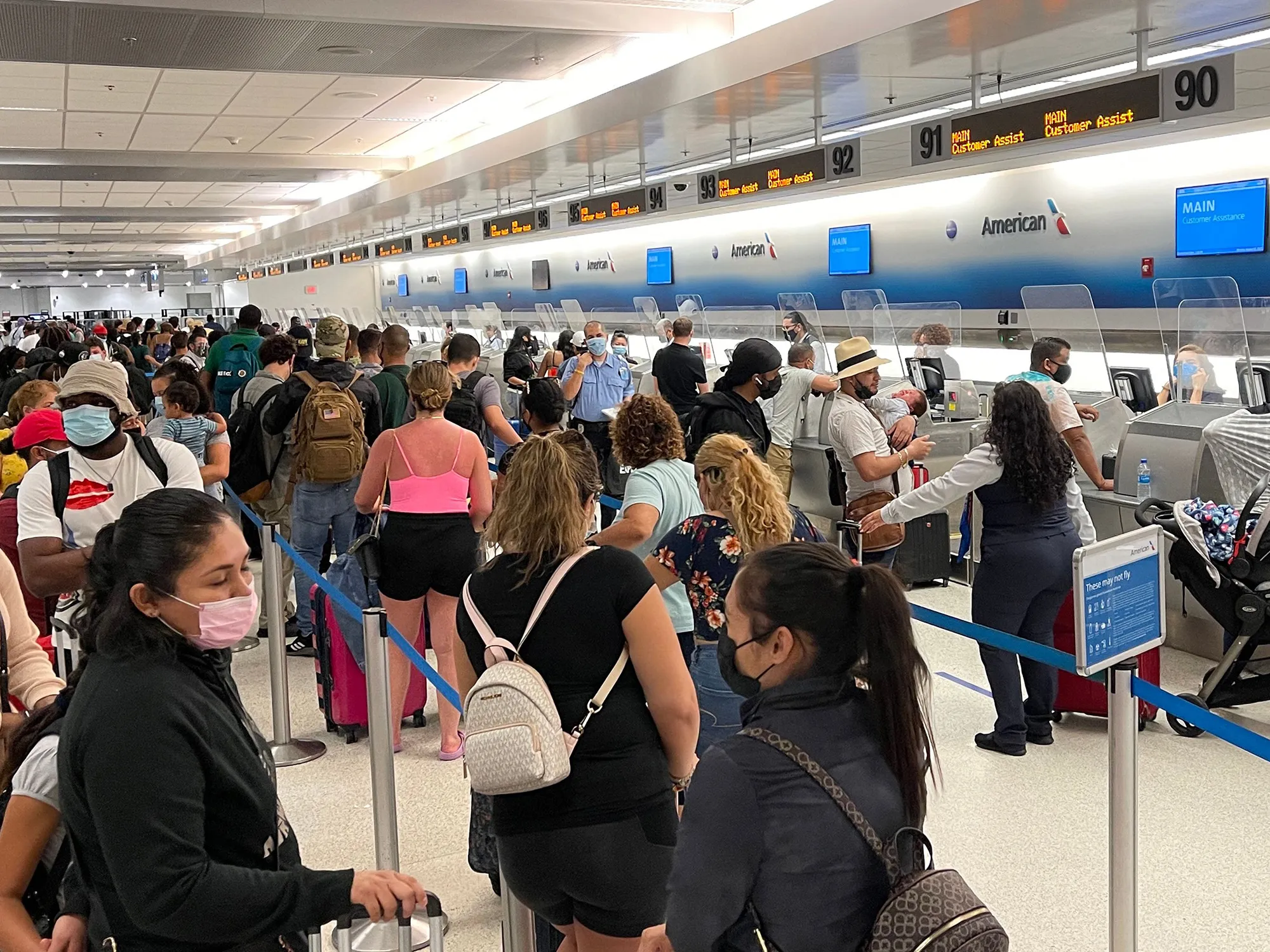 Travelers at the American Airlines departure desks at Miami International Airport on Aug. 2.