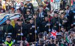 King Charles III, Princess Anne, Prince Andrew, Duke of York, and Prince Edward, walk behind the hearse carrying Queen Elizabeth II's coffin on the Royal Mile in Edinburgh, Scotland, on Sept. 12. 