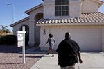 A prospective home buyer arrives to look at a home for sale in Chandler, Arizona.