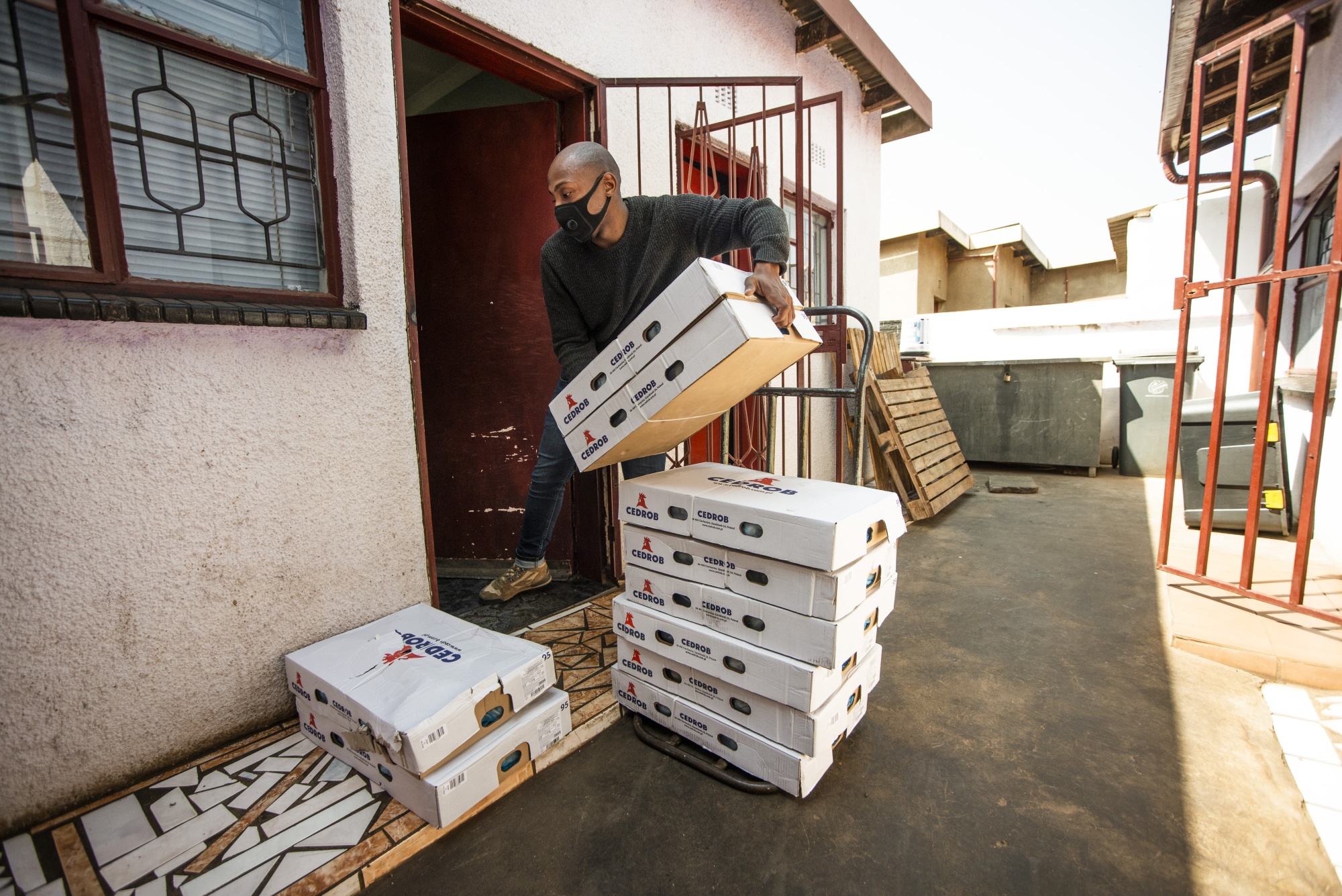 Kopano Mofokeng,&nbsp;owner of Kasi Convenience, unloads a&nbsp;delivery in Soweto.