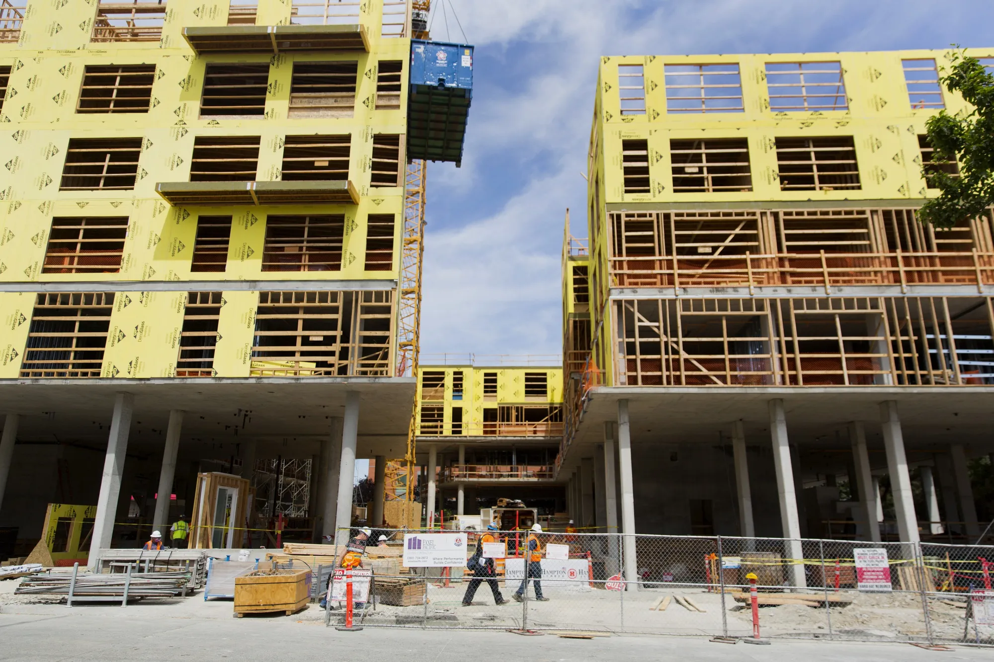 Contractors work on construction of a new apartment building in downtown Seattle, Washington.