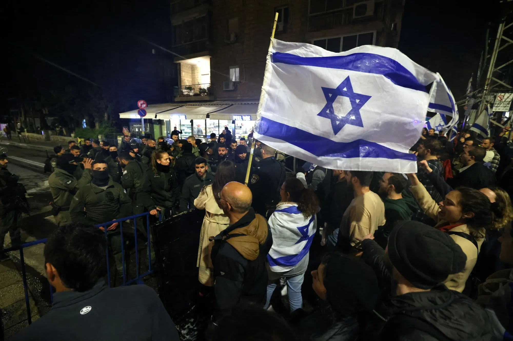 Demonstrators rally outside&nbsp;Netanyahu's residence on March 27.