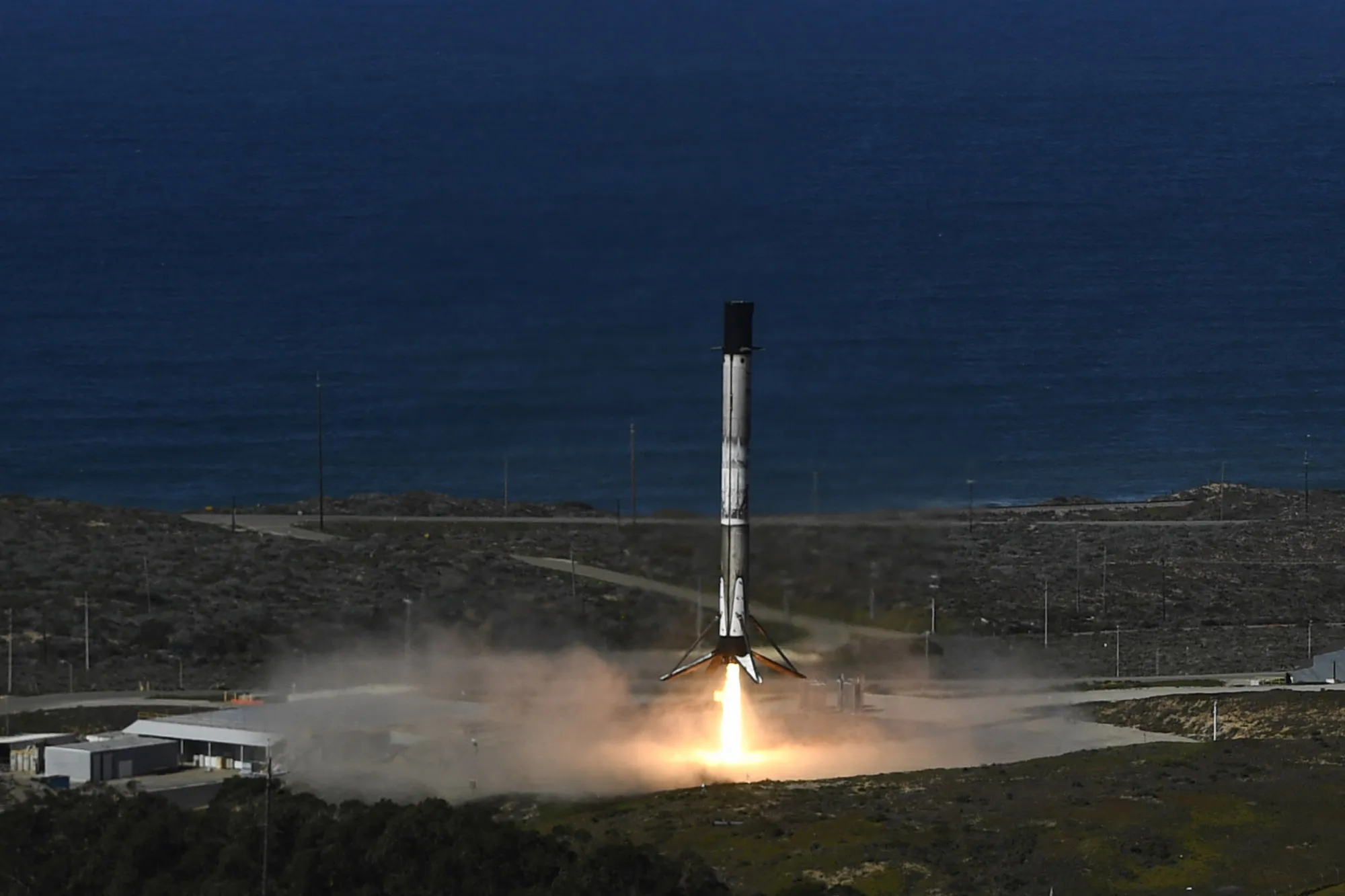 A Falcon 9 rocket returns to land after the launch of the NROL-87 spy satellite payload.