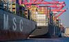 Cargo ships line up at the Total Terminals berth at the Port of Long Beach in Long Beach, California, U.S., on Wednesday, April 4, 2018. The U.S. trade deficit widened by more than forecast to a fresh nine-year high in February amid broad-based demand for imports, ahead of Trump administration tariffs that have raised the specter of a trade war.