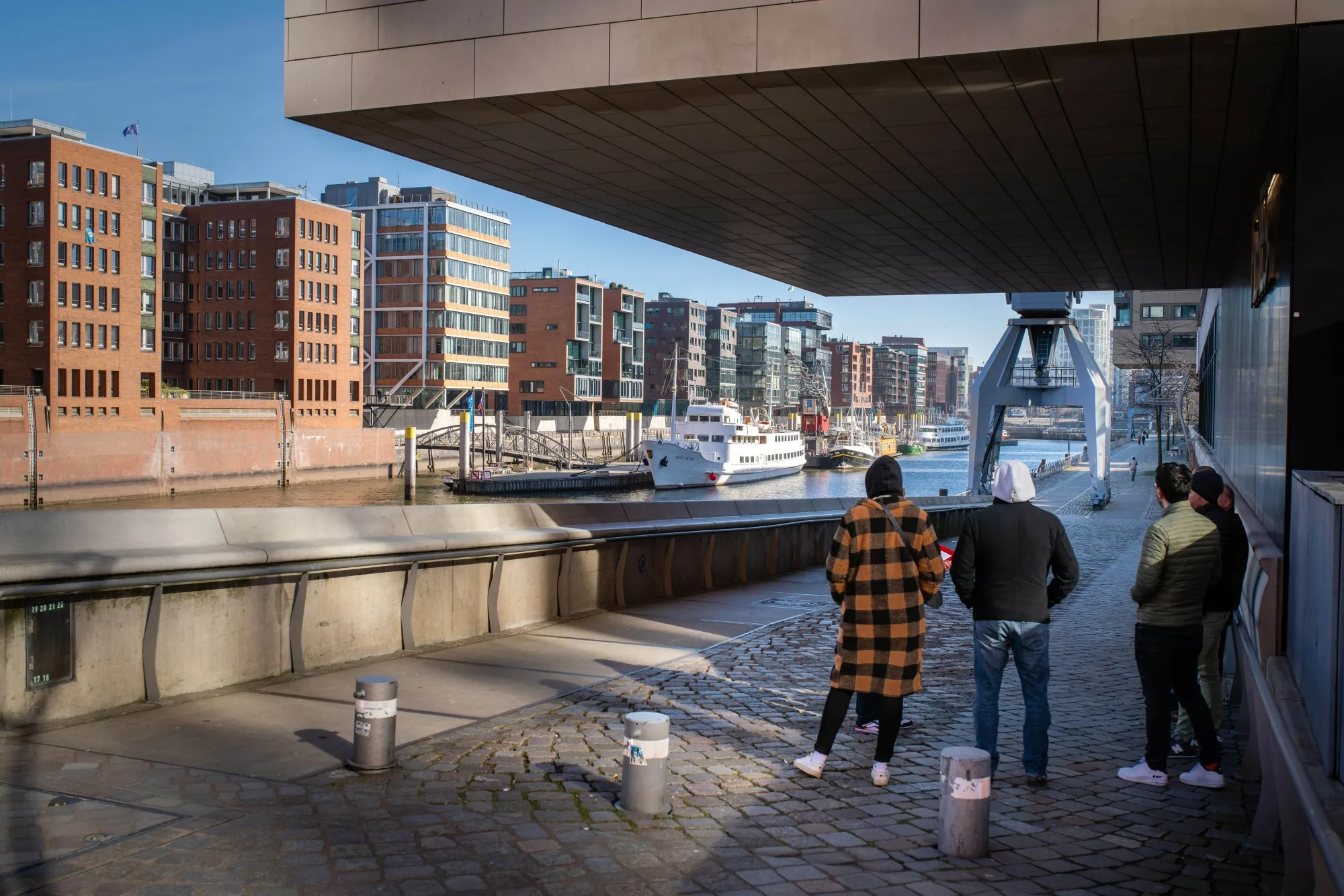 Residential buildings line a canal in Hamburg.