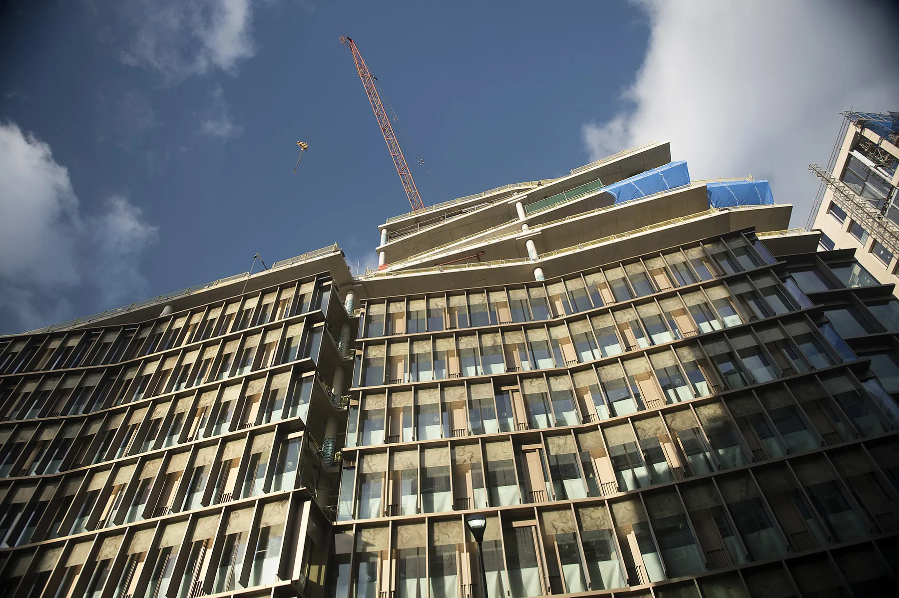 A construction crane operates above the Zig Zag office and retail building development by Land Securities Group Plc, in London. Photographer: Matthew Lloyd/Bloomberg
