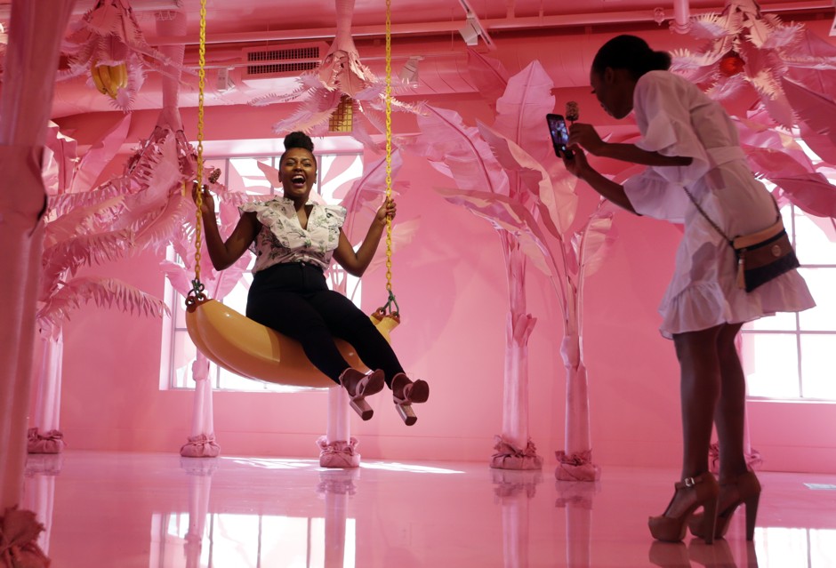 Visitors take photos at a Museum of Ice Cream pop-up in Miami in 2017.