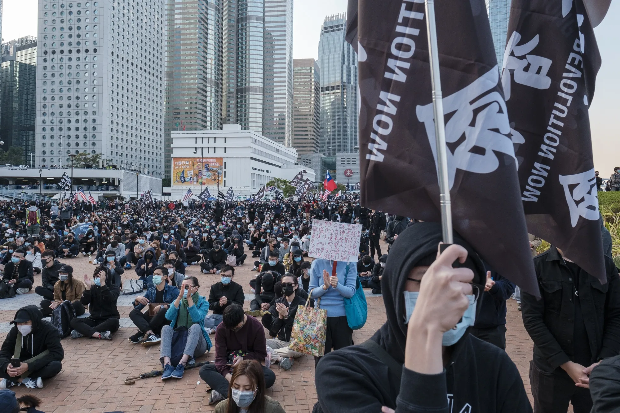 Demonstrators hold flags reading "Free Hong Kong. Revolution Now" during a rally at Edinburgh Place on&nbsp;Jan. 12.&nbsp;