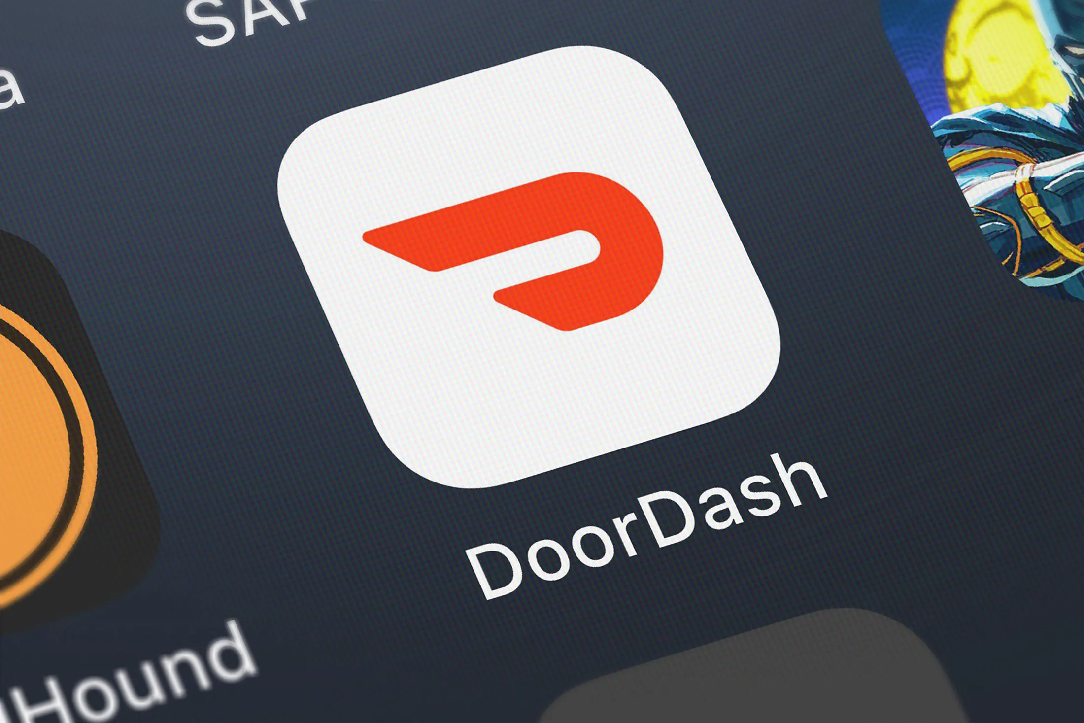 London, United Kingdom - October 19, 2018: Close-up of the DoorDash - Order Food Delivery icon from DoorDash, Inc. on an iPhone.