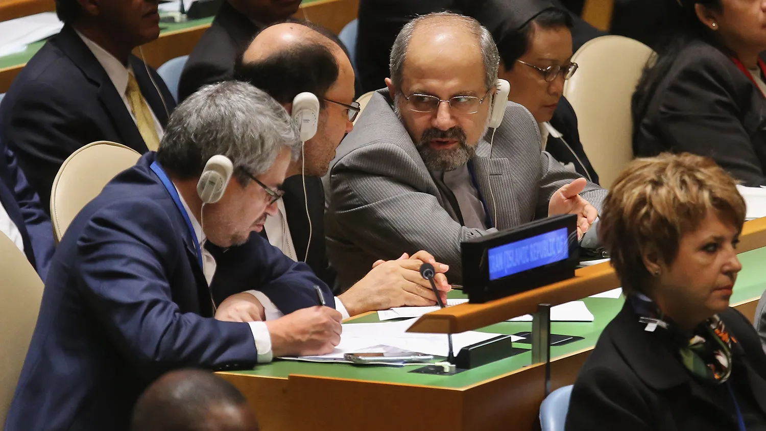 Iranian Minister of Foreign Affairs Mohammad Javad Zarif (center) talks with members of his delegation as U.S. President Barack Obama addresses the 70th annual United Nations General Assembly at the UN headquarters on Sept. 28, 2015, in New York City.
