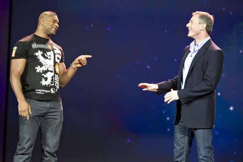 UFC fighter Alistair Overeem, left, and Paul Jacobs, Qualcomm's then CEO, speak at CES 2012.