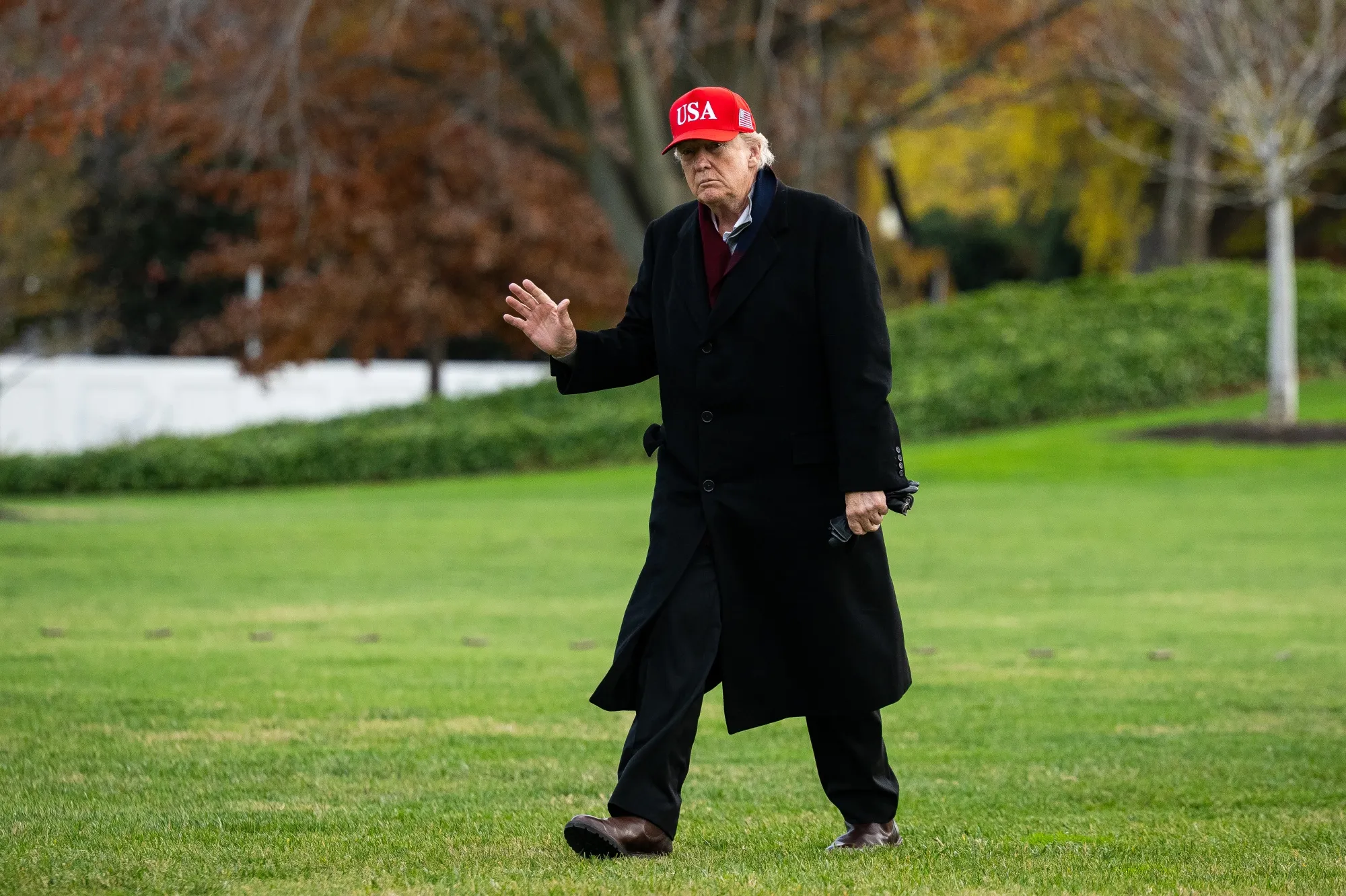 Trump walks on the South Lawn of the White House after arriving on Marine One in Washington on Saturday