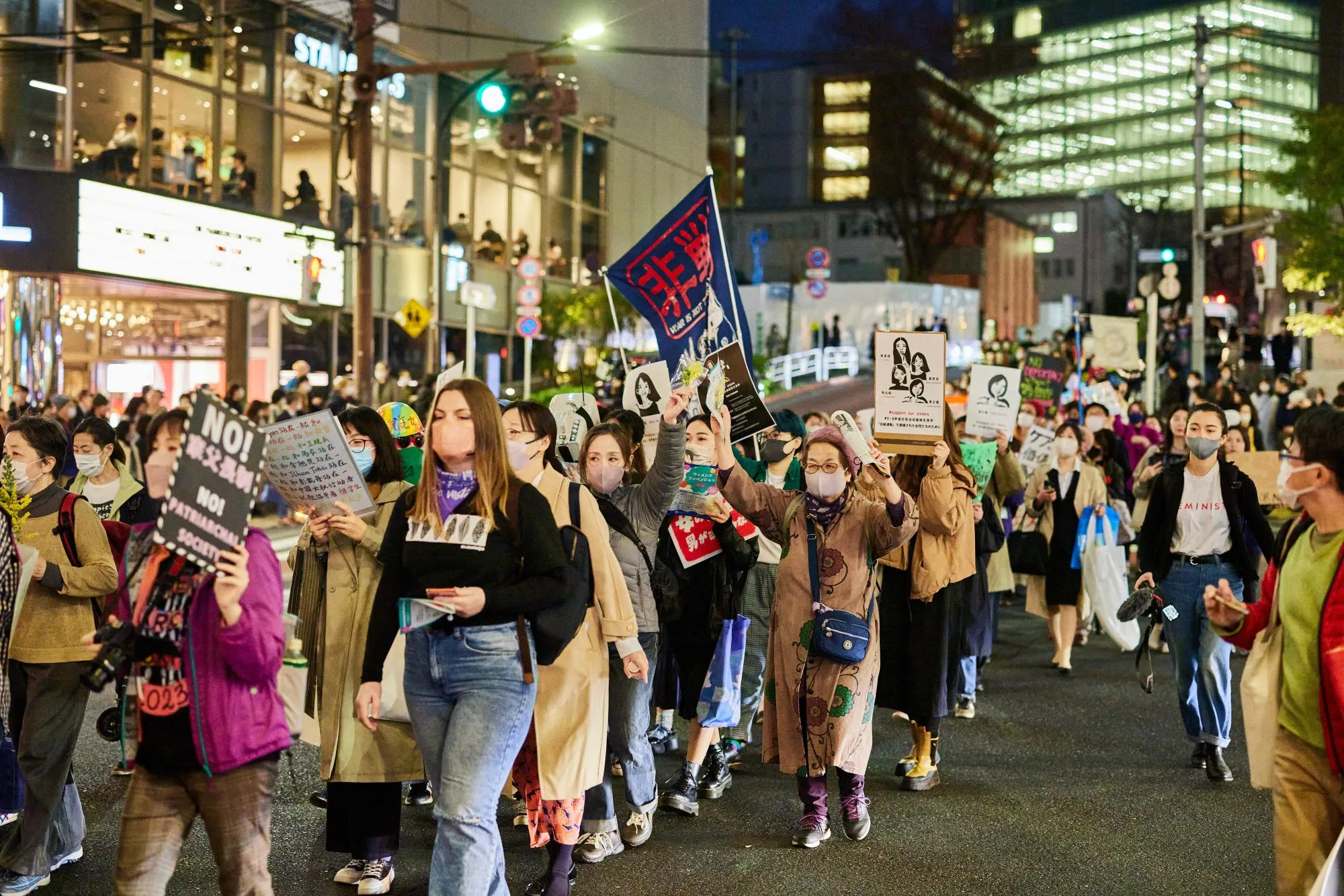 Demonstrators at a Women's Day march in Tokyo earlier this year. A tough work culture in Japan has made it hard for some working women to start families.&nbsp;