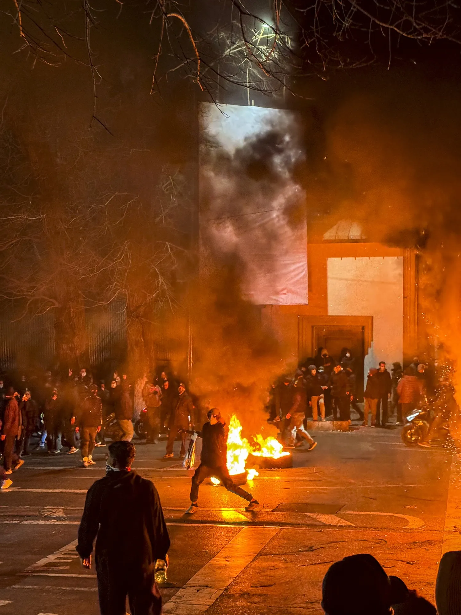 Demonstrators block a street during a protest in Tehran, on Jan. 9.