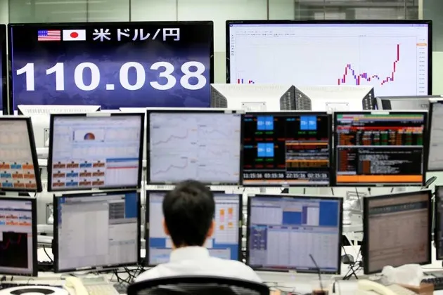 An electric board shows the exchange rate of Japanese yen to the U.S. dollar in Tokyo on Oct. 1