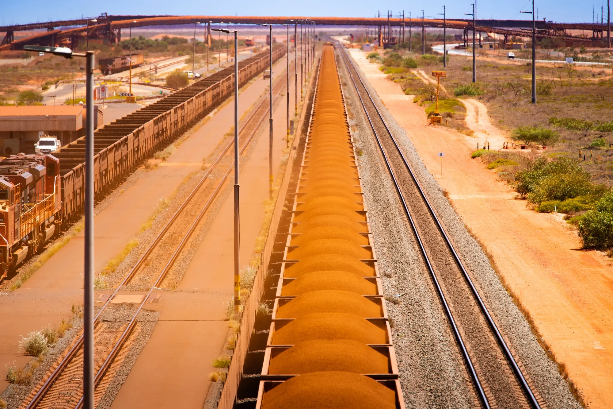 Wagons Of Iron Ore Make Their Way To Port By Rail And Road