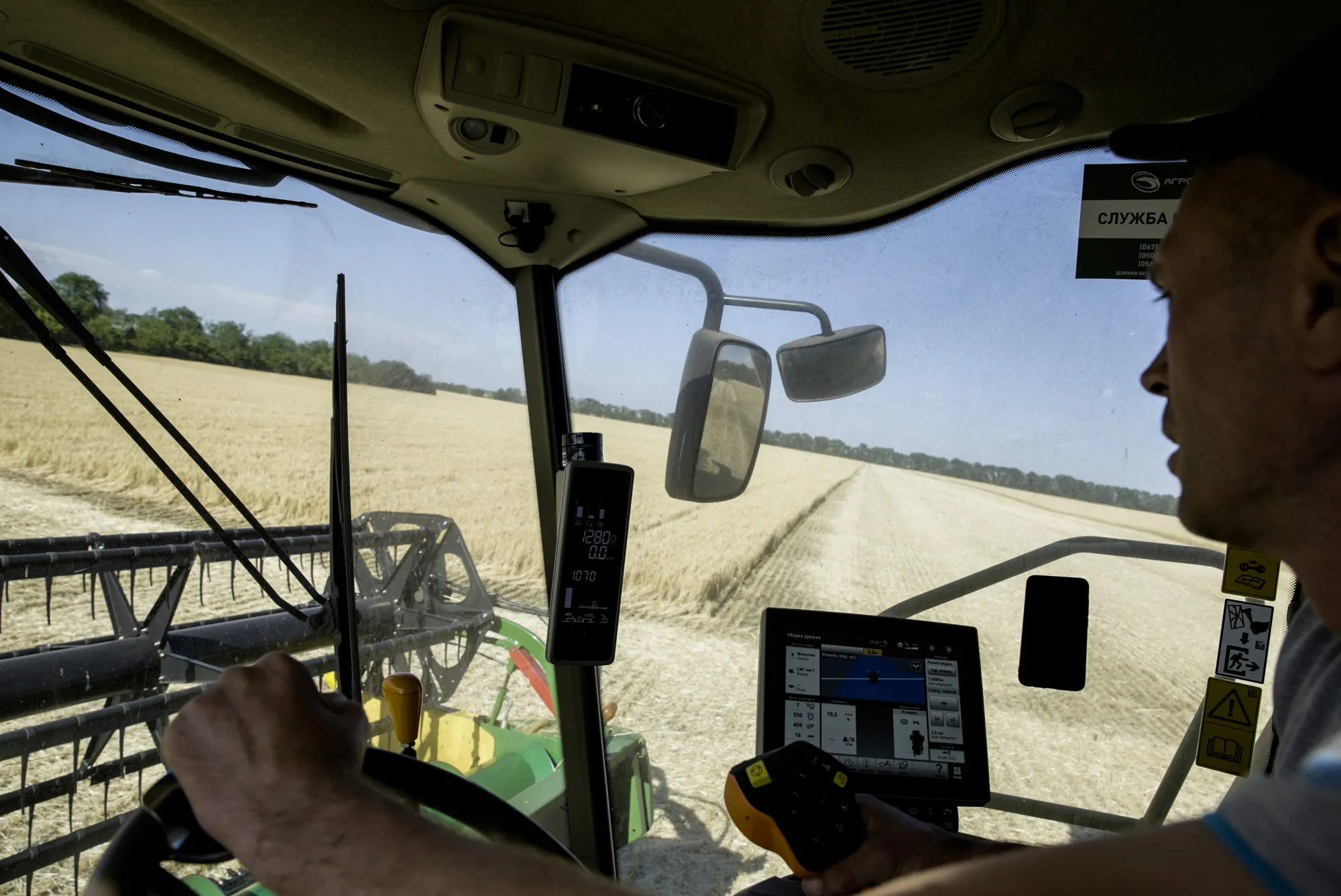 A farmer operates a combine harvester cutting through a field of wheat&nbsp;in Kryvyi Rih, Ukraine, on June 28.