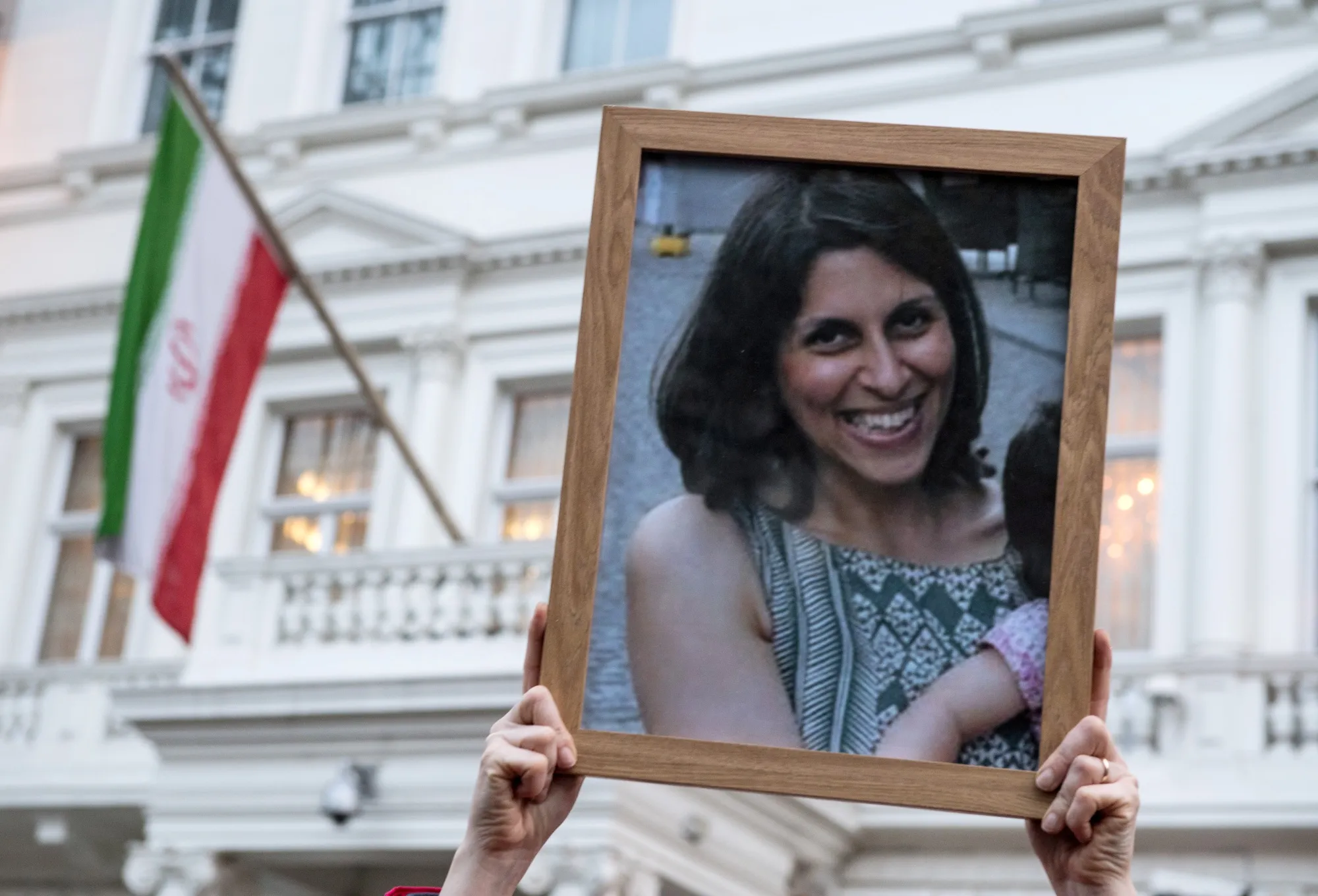 A supporter holds a photo of Nazanin Zaghari-Ratcliffe during a vigil in 2017.