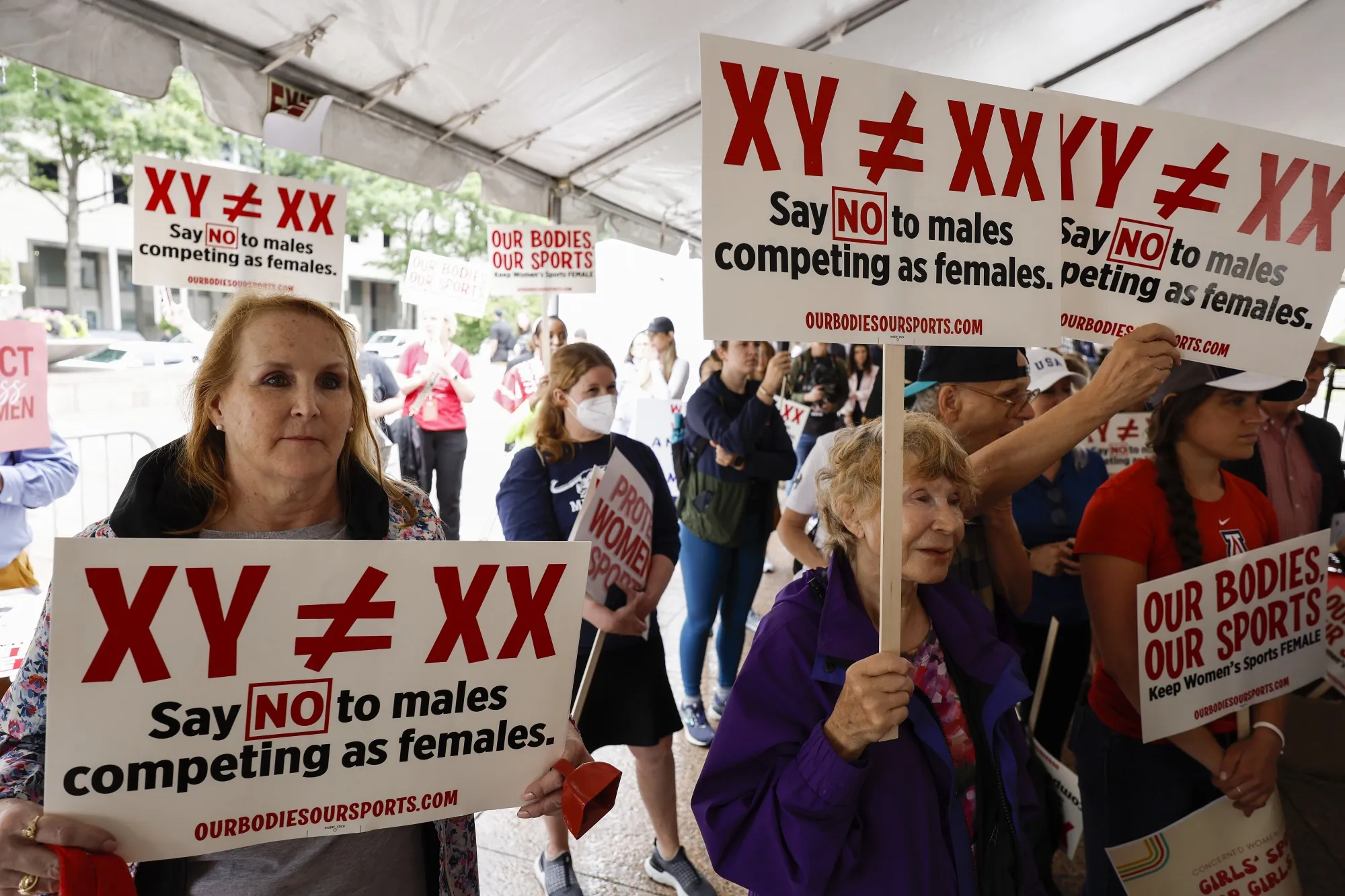 Demonstrators during an "Our Bodies, Our Sports" rally held to call on the Biden administration's Title IX regulations in&nbsp;Washington, 2022.&nbsp;