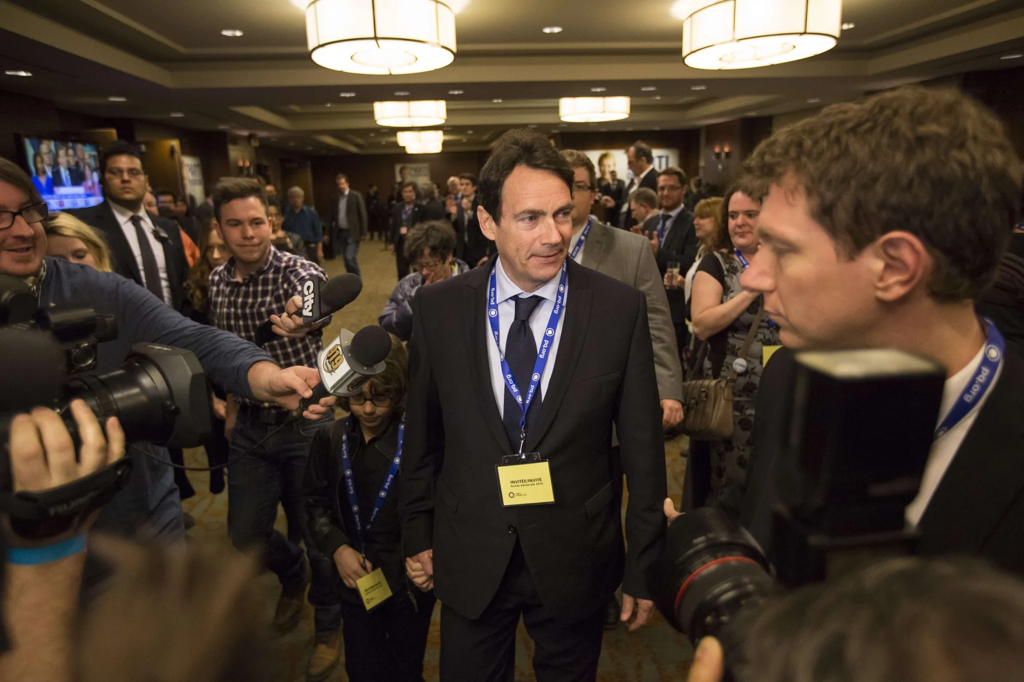 Pierre Karl Peladeau enters an election-night event in 2014 after his entry into politics.
