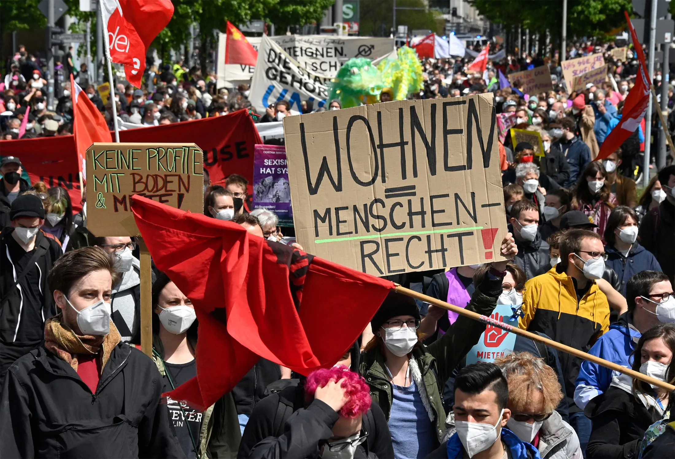 A protester holds a sign reading “home is a human right” during a demonstration in Berlin, on May 23.