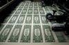 50 subject one dollar note sheets are run through an intaglio printing press before the face is printed at the U.S. Bureau of Engraving and Printing in Washington, D.C., U.S., on Tuesday, April 14, 2015. Republican efforts to pass a fiscal year 2016 budget cleared another hurdle as the House named its members to a conference committee and Senate Majority Leader Mitch McConnell pledged to do the same by the end of the week.