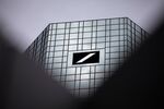 The Deutsche Bank AG logo sits on the skyscraper headquarter offices.