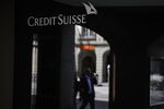 A sign hangs above the entrance to a Credit Suisse Group bank branch.