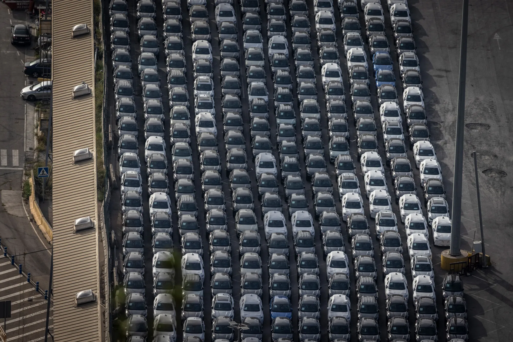 Newly-manufactured automobiles on the dockside at the port of Barcelona.