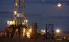 An oil drilling rig stands on the Bakken formation in Watford City, North Dakota, U.S.