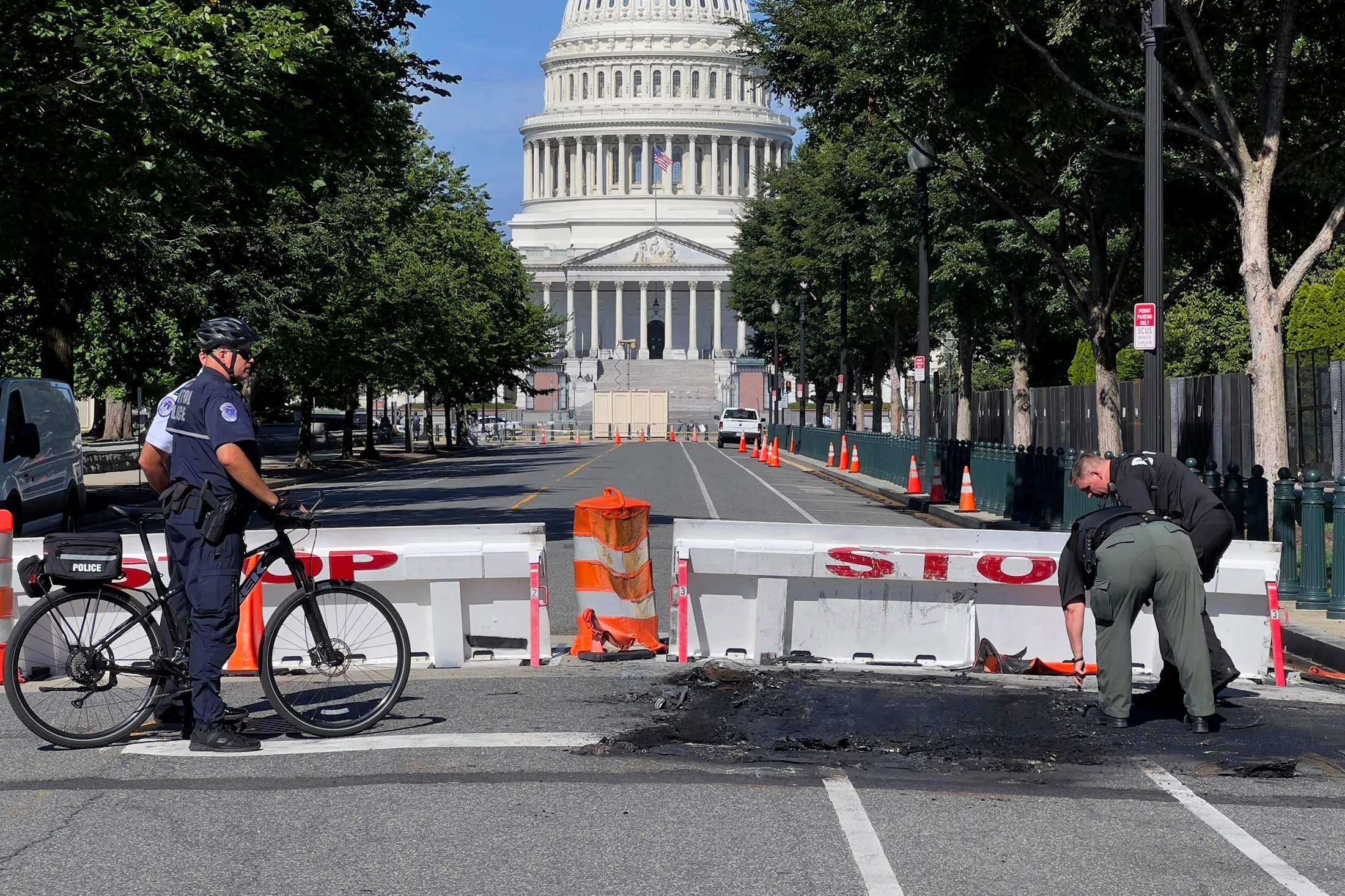 US Capitol Police Officers clean up following the incident&nbsp;near a barricade on Capitol Hill in Washington, D.C., on Aug. 14.