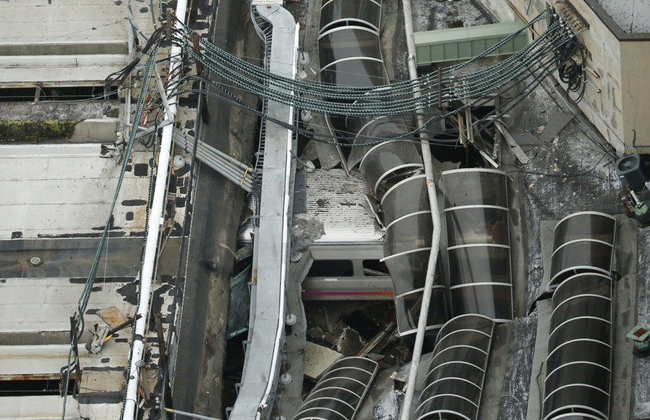 A derailed New Jersey Transit train is seen under a collapsed roof after it derailed and crashed into the station in Hoboken, New Jersey.