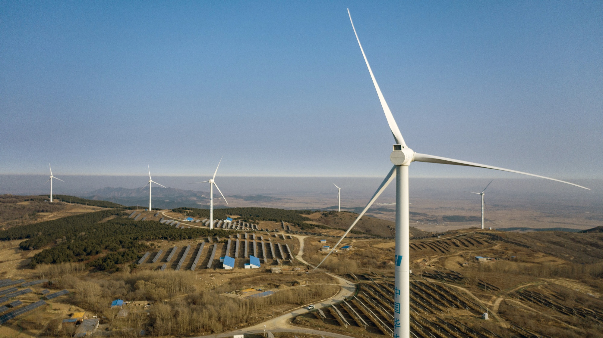 Wind turbines and solar panels in this aerial photograph taken near Fuxin, China, on&nbsp;Nov. 16, 2020.