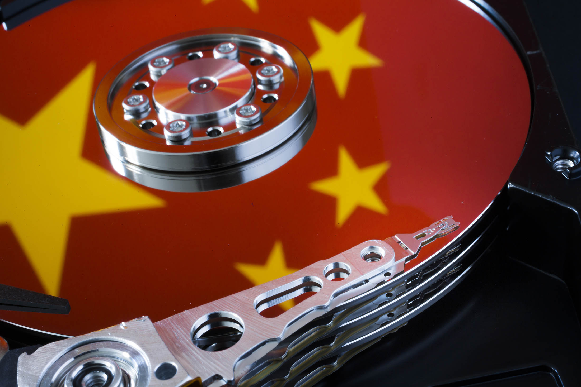 BERLIN, GERMANY - JANUARY 29: Symbolic photo for data protection, reflection of the flag of China in a computer hard drive on January 29, 2015 in Berlin, Germany.
