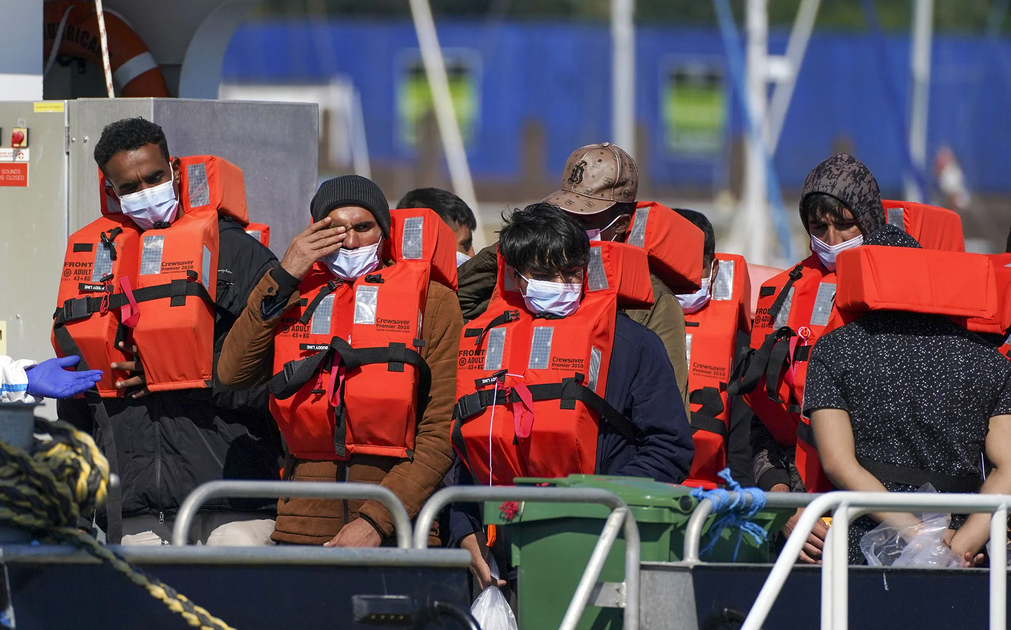 A group of people thought to be migrants are brought into Dover, Kent, on Sept. 8.