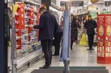 A shopper browses goods inside a Sainsbury supermarket in the UK. 