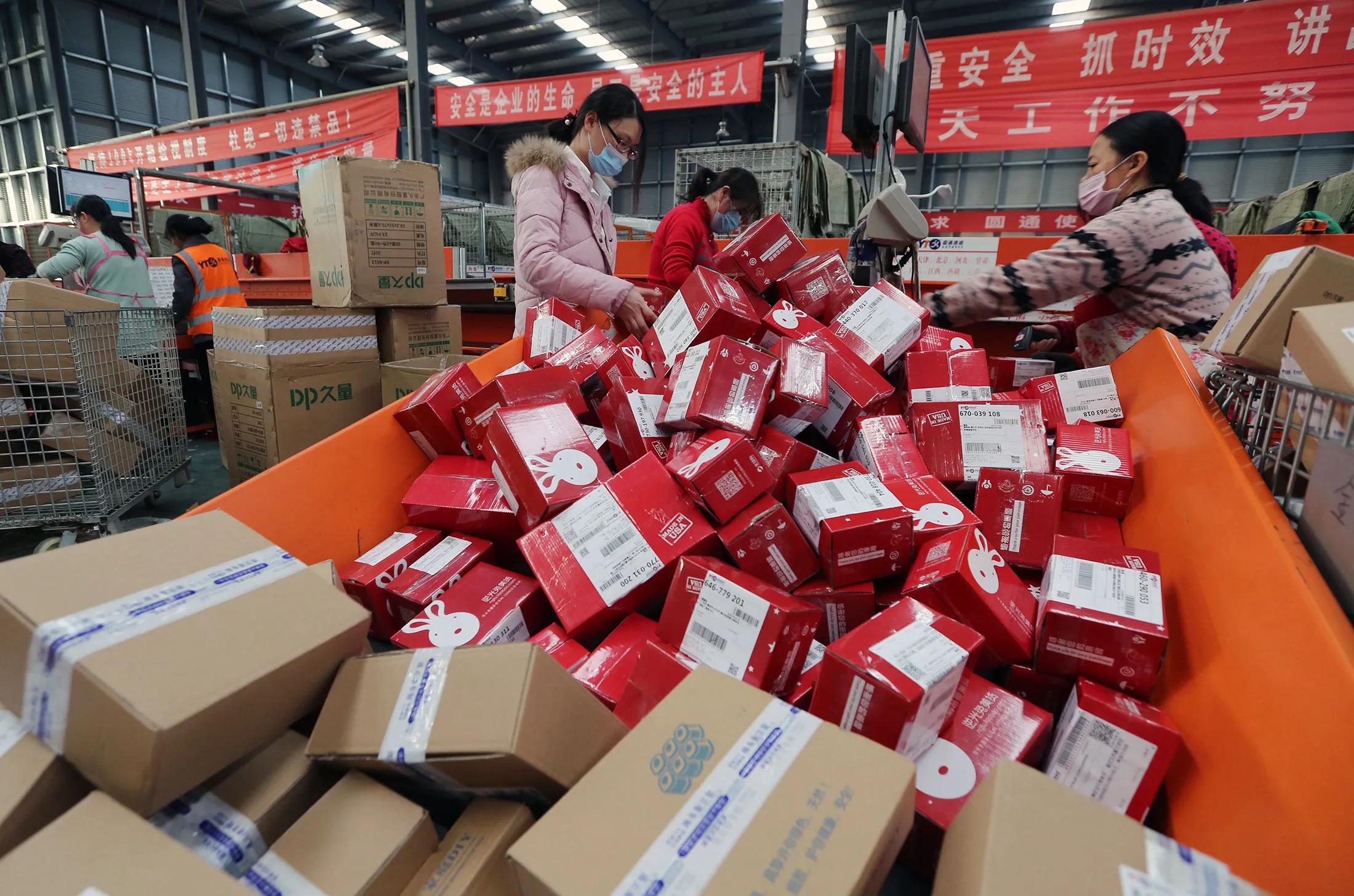 Workers prepare boxes for delivery at a sorting center in Lianyungang.