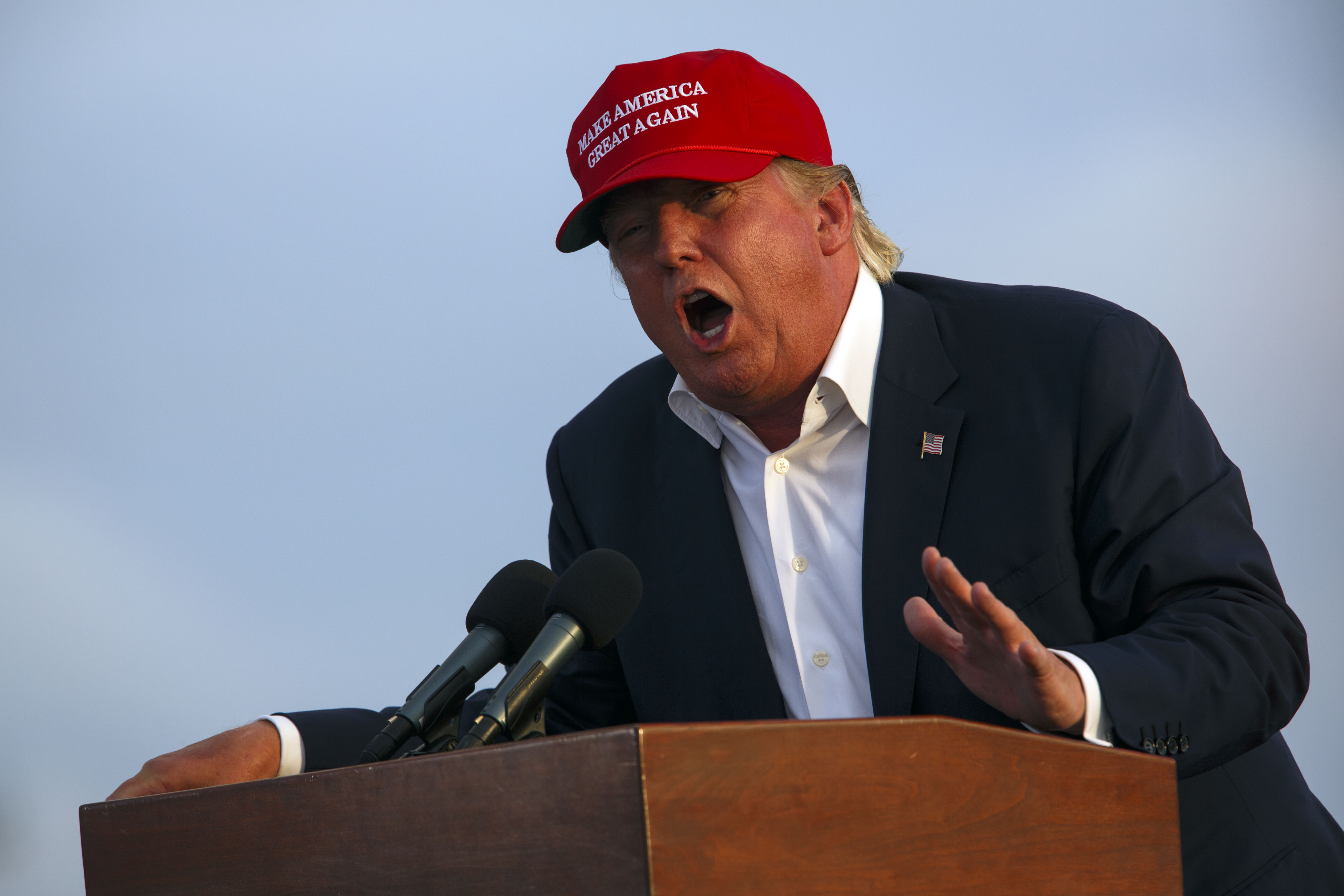 Donald Trump, president and chief executive officer of Trump Organization Inc. and 2016 Republican presidential candidate, speaks during a rally aboard the Battleship USS Iowa in San Pedro, California, U.S., on Tuesday, Sept. 15, 2015. Trump said Sunday that he would flesh out his tax proposals in the coming weeks, but again vowed to raise rates on hedge fund managers, who the billionaire has portrayed as "getting away with murder." Photographer: Patrick T. Fallon/Bloomberg *** Local Caption *** Donald Trump