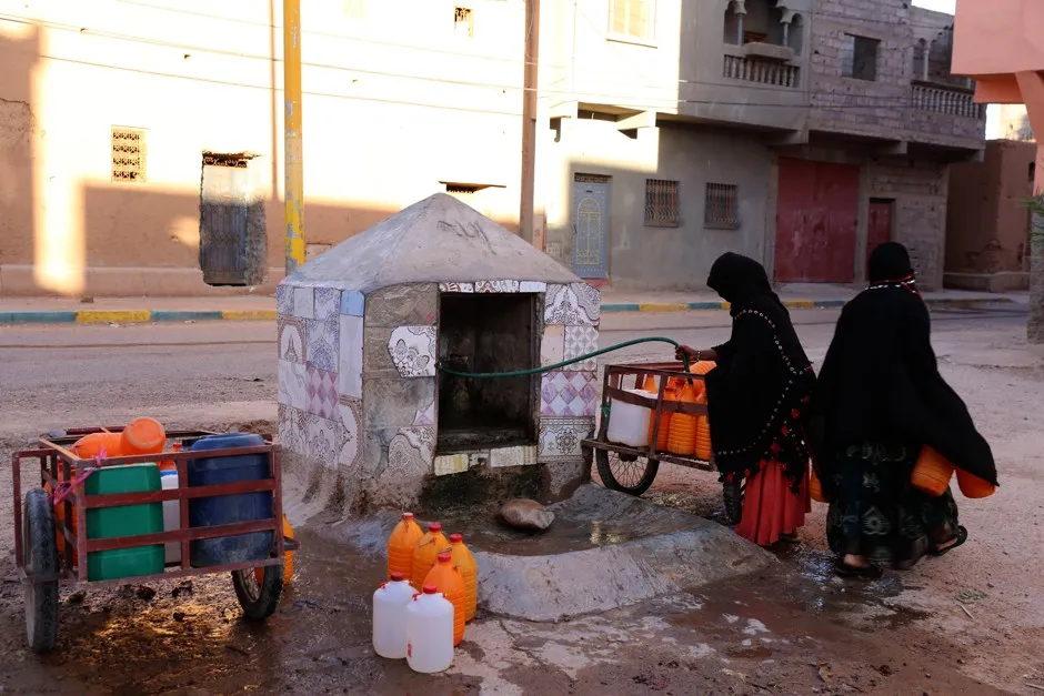 In Oct. 2017, women filled bottles with water in Zagora, Morocco during a water shortage.  Experts blamed the shortage on growing populations, climate change and agricultural choices.
