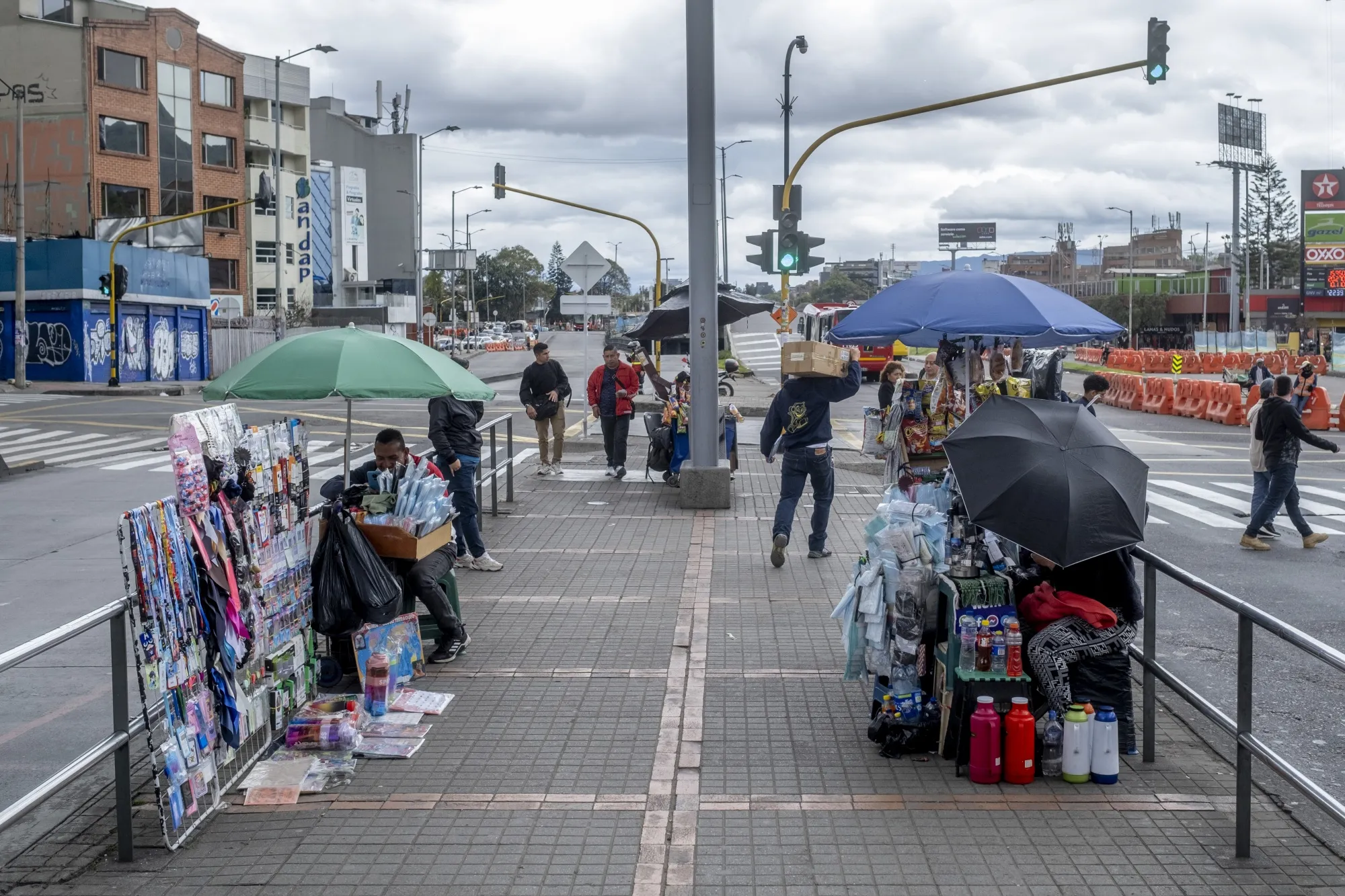 Pedestrians near the Heroes Transmilenio mass-transit station in Bogota, Colombia.